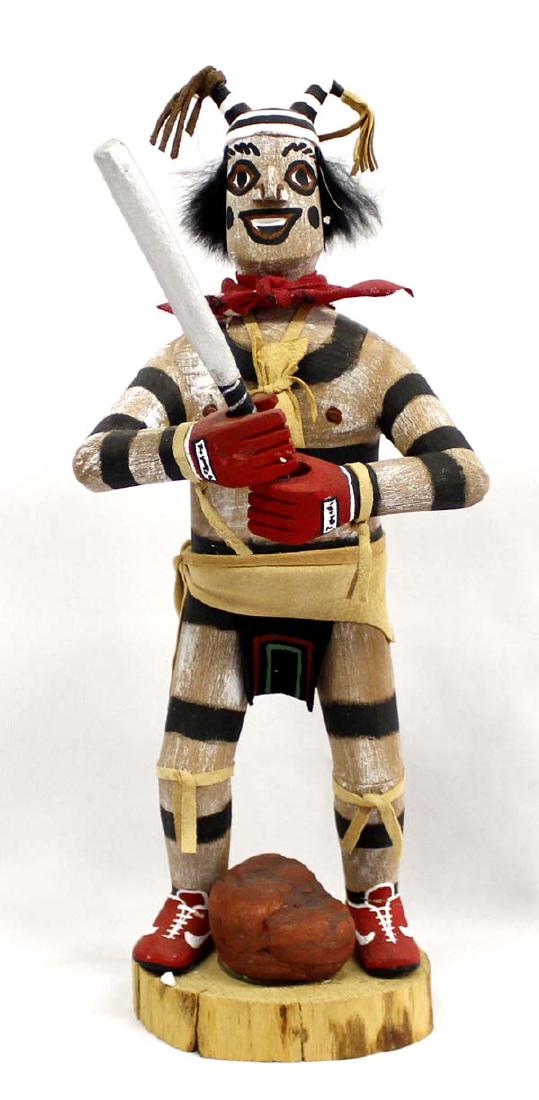 Navajo Koshare Hano Clown Kachina by Felix Begay: Navajo Koshare Hano Clown Baseball Player Kachina by Felix Begay, measures 10.5'' x 5'', embellished with leather, red bandana, and rabbit fur, signed by artist