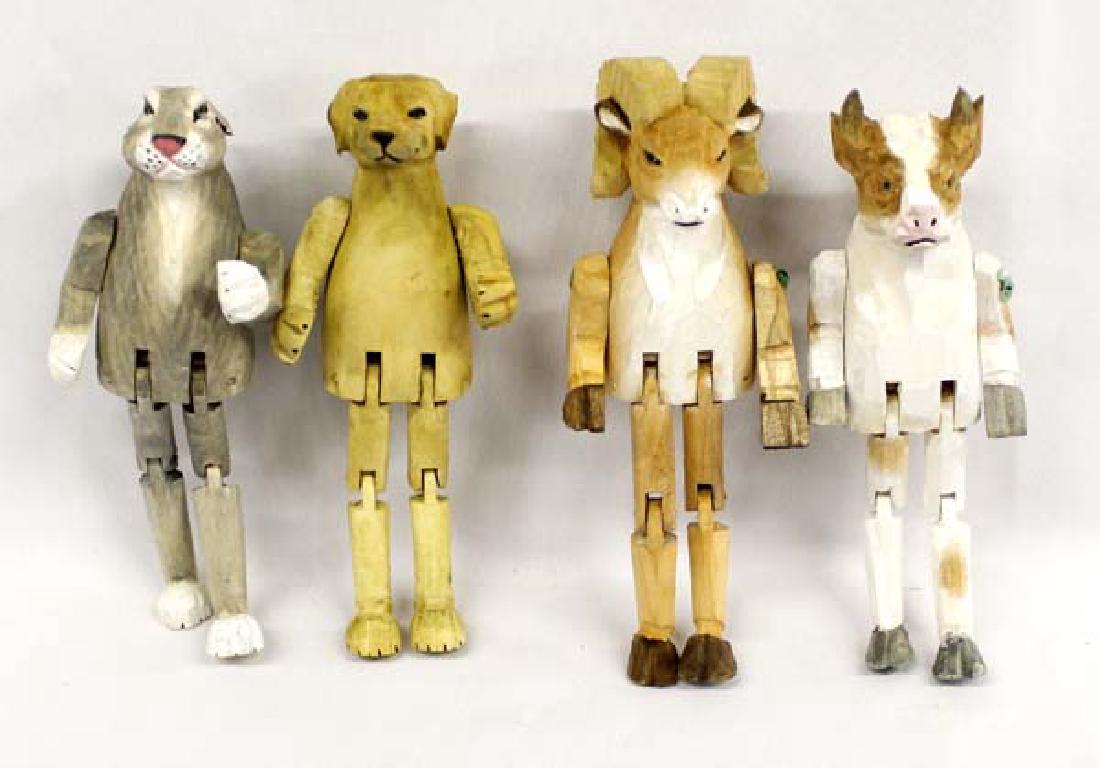 4 Chinese Carved Bass Wood Animals: 4 Chinese Carved Bass Wood Animals, all are articulated and sit on shelf or table, measure 7.5''L and includes a rabbit, dog, bighorn ram, and cow