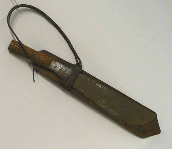 Asian Wicker Handle Machete With Wood Scabbard: Asian Wicker Handle Machete With Wood Scabbard. Wood scabbard measures approx. 18 1/2 x 3 1/2 inches, blade on machete measures approx. 15 x 2 1/2 inches, handle measures approx. 5 1/4 inches. Woven l