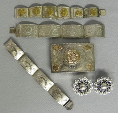 5 Mexican Silver Bracelets, Earrings, & Buckle: 5 Mexican Silver Bracelets, Earrings, & Buckle. 3 Mexican silver link bracelets and one pair clip earrings and a belt buckle. The buckle measures approx. 6.5''L x 2.25''W. The earrings are approx. 1.5