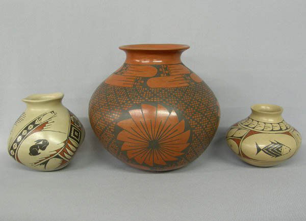 3 Mata Ortiz Jars, 8''x8'', 4''x5'' & 5''x5'': 3 Mata Ortiz jars; black on red by Miguel Bugarini measures approx. 8''Hx8''W, fish design by Martha Villalpando approx. 4''x5'' & rabbit design by Martha Villalpando approx. 5''x5''. SHI $65.
