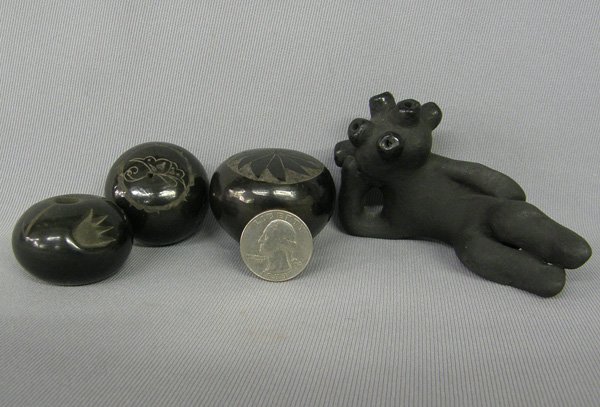 4 Miniature Santa Clara Pottery Largest 2''x4'': 4 Miniature Santa Clara Pottery Largest 2''x4''. Mudhead is signed by Dorothy and the others are hallmarked. SHI $40.