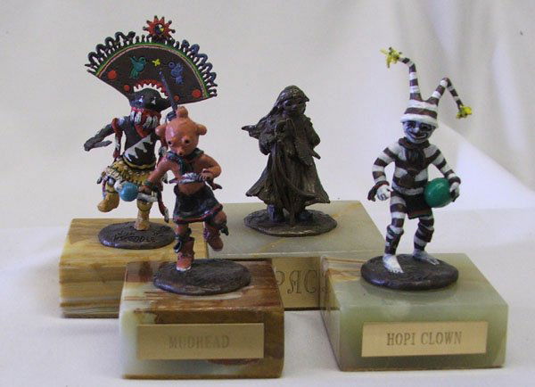 4 Miniature Signed Bronzes By Joy Weddle 4''H: 4 Miniature Signed Bronzes By Joy Weddle 4''H. Numbered, 3 have plaques, Apache, Hopi Clown and Mudhead. SHI $25.