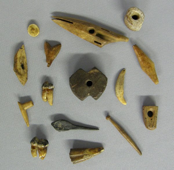 15 Prehistoric Eskimo Artifacts 4'': 15 Prehistoric Eskimo Artifacts 4''. Ivory dog sled linkage. Teeth and tools. SHI $15