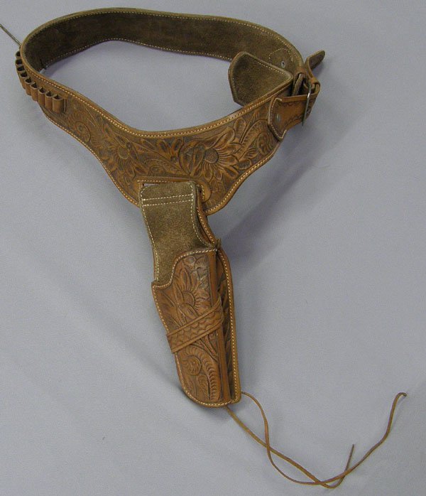 Hand Tooled Leather Holster 14'' & Gun Belt 45'': Hand Tooled Leather Holster 14'' & Gun Belt 45''. SHI $25.