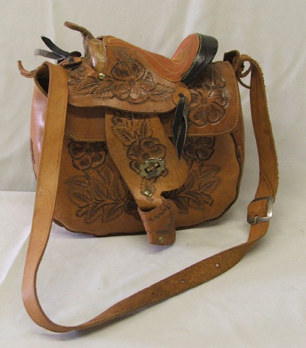 Hand Tooled Leather Saddle Purse 12"x10": Hand Tooled Leather Saddle Purse 12" high without handle, 25''L Including Handle, 12'' Wide. SHI $20.