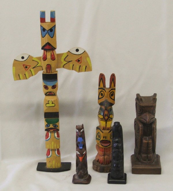 5 Northwest Coast Style Totem Poles 15'' Largest: 5 Northwest Coast Totem Poles 15'' Largest. Some of these are composition. SHI $25.