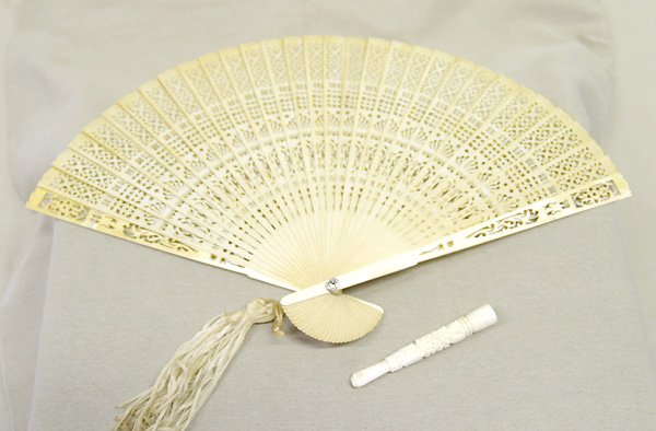 Geisler Estate Ivory Fan & Cigarette Holder: 2 Estate Carved Ivory Ladies Fan & Cigarette Holder. Fan 8'' Blades. Cigarette Holder 3''. SHI $15.
