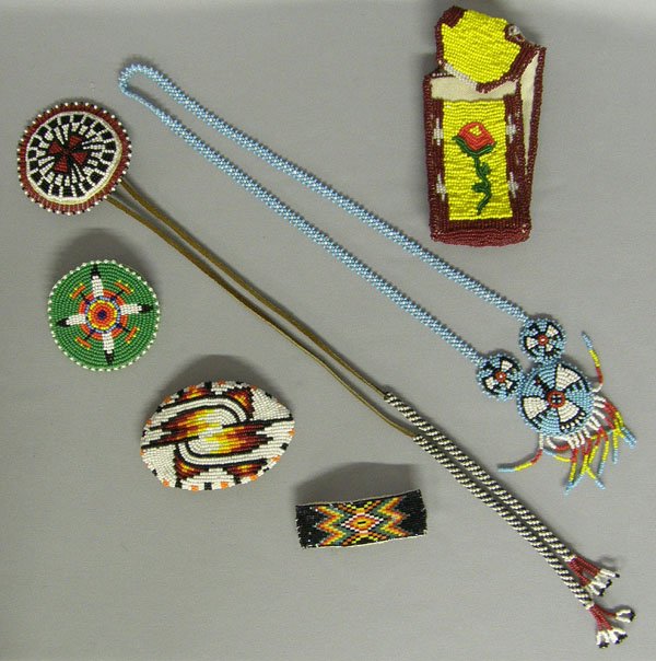 6 Plains Indian Beadwork including 3 Barrettes 5": 6 Items, 3-Beaded Barrettes, 1-Necklace, 1-Phone Holder, 1-Hair Tie. Phone holder measures 5'' x 2''. SHI $15.