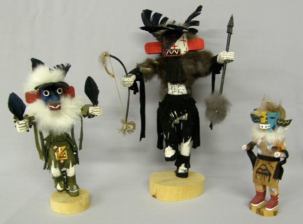 3 Navajo Kachina Dolls 12''High: 3 Indian Kachinas, tallest 12''. Hototo By Kimerlin Ramone, Kachina with spear and bow and 3rd Kachina. SHI $40.