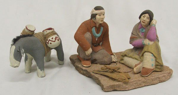 2 Pottery Statues, 2 Indians & 1 Donkey 5'' x 8'': 2 Pottery Statues, 2 Indians & 1 Donkey is missing an ear, 5'' x 8''. SHI $30.