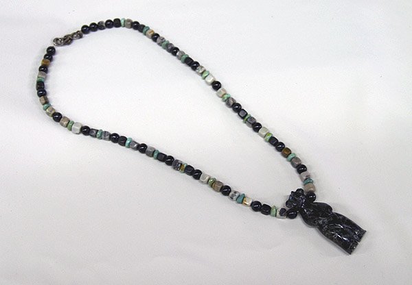 Navajo Fetish Necklace by Terry Shafer 25'': Fetish Necklace by Terry Shafer 25''. Picasso marble bear pendant is 2.5''. Beads are serpentine, tigers eye, turquoise & marble. SHI $15.