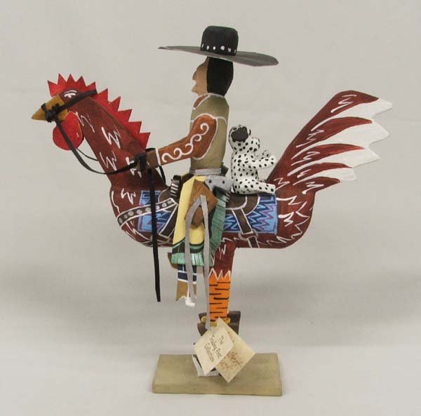 Navajo Folk Art Cowboy w/ Dog Riding a Rooster: Navajo Folk Art, Cowboy and Dog On Rooster By Delbert Buck 12'' x 11''. Rooster has his cowboy boots on. Buck, the artist, always makes you smile. SHI $25.