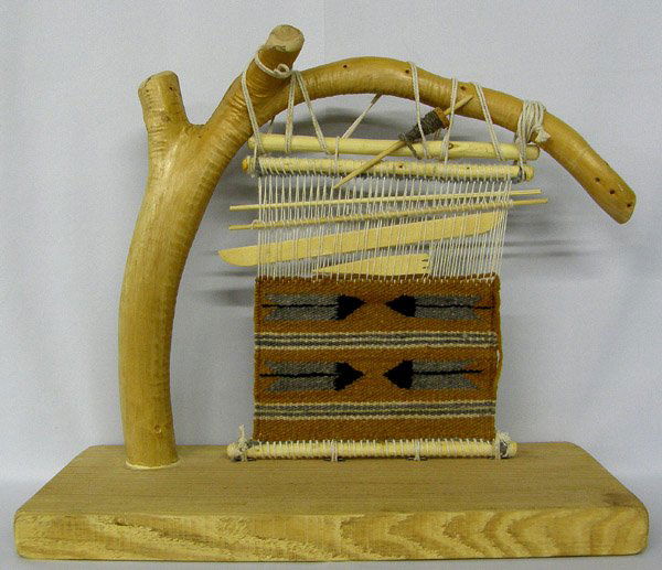 Navajo Weaver & Loom by Herman Tsosie & Nellie: Navajo Weavers Loom Model by Herman Tsosie & Nellie. Measures 16''x18''x7''. SHI $35.