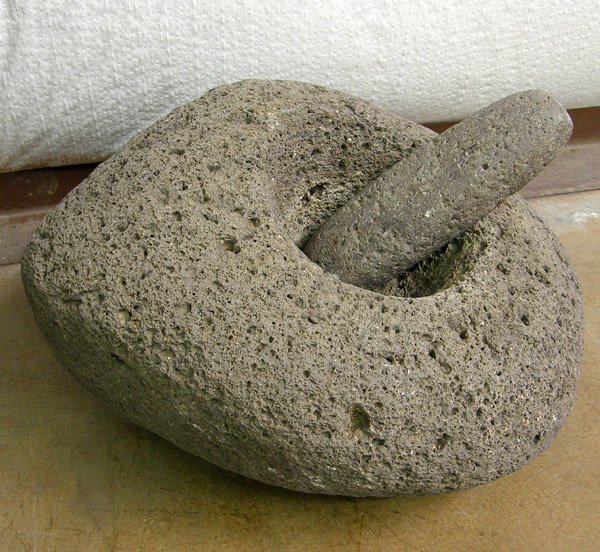 Prehistoric Grinding Stone with Pestle: Prehistoric Grinding Stone with Pestle, measures 7"H x 15"W. MUST BE PICKED UP.