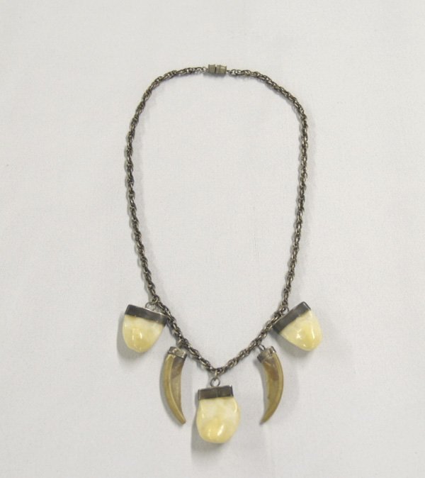 Antique Ivory Moose Teeth Choker with Claws: Antique Ivory Moose Teeth Choker with Claws, measures 16.5"L, teeth are approx. 1"L including Brass Caps. SHI $15