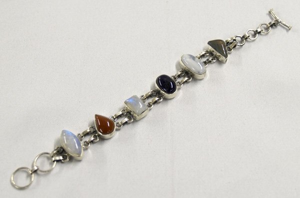 Silver Multi Colored Agate Link Bracelet: Sterling Silver Multi Colored Agate Link Bracelet, measures 7"L with stones up to .75"L. SHI $15