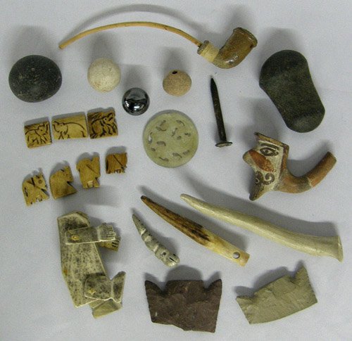Unique & Unusual Oddities from New Mexico: Bone Mechanical Primitive Doll, measures approx. 5"L, legs and arms move. Bone Fetish, Magnetized marble on top of RR nail, Prehistoric Clay marble, Bone Puzzle, Large Spear Head Tops, Two PRehistoric