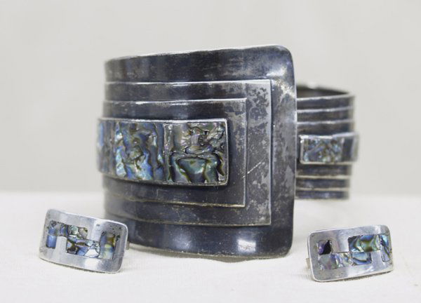 Mexican Taxco Silver & Abalone Bracelet, Earrings: Mexican Taxco Silver & Abalone Bracelet, Screw back 1'' Earrings. Bracelet is 6.5'' inside and 7/8'' to 1-7/8'' in width. The bracelet is a hinged bracelet. SHI $15.