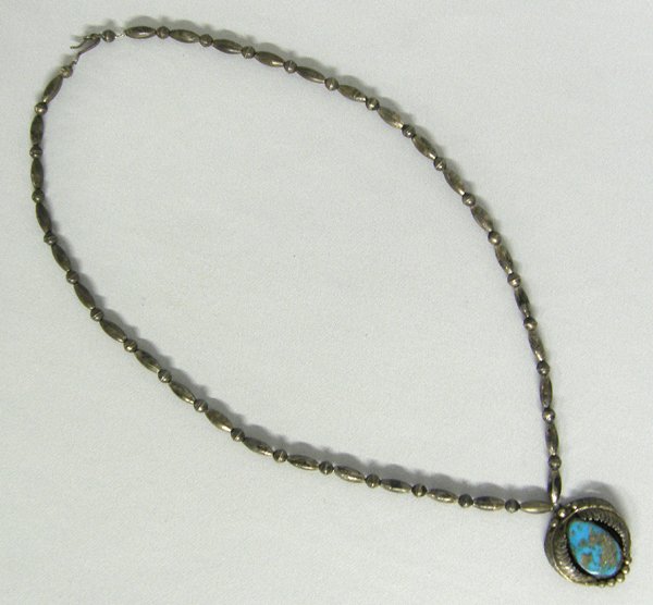 Navajo Lone Mountain Turquoise Necklace: Navajo Lone Mountain Turquoise Necklace. Chain 25'' end to end. Pendant 1.25''. SHI $15.