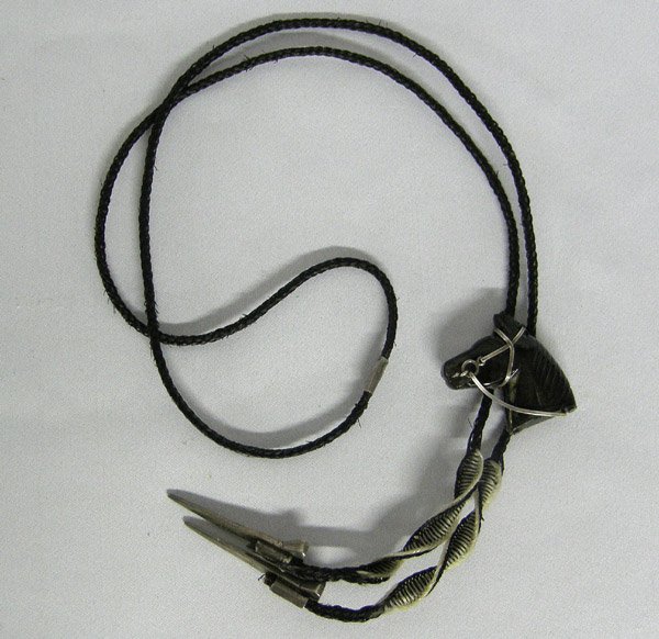 Hand Made Hematite Silver Horse Head Bolo Tie: Hematite Horse Head Bolo Tie. Braided Horse Hair Tie with Horse Shoe Nails as Tips. The slide measures approx. 1 1/2'' with sterling silver halter. SHI $15.
