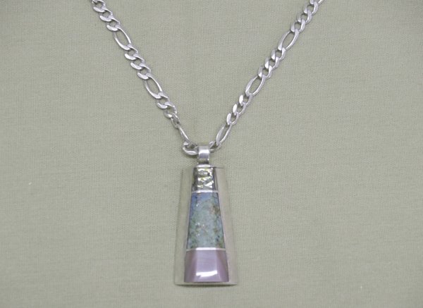 Navajo Silver Turquoise Necklace Hallmark: Navajo Silver Turquoise Necklace With Hallmark ''AJ'' (A over J). Pendant is abalone, turquoise and sugalite inlay. Chain is handmade silver. Length is 18'' end to end, pendant is 1.5''x0.75''. SHI $1