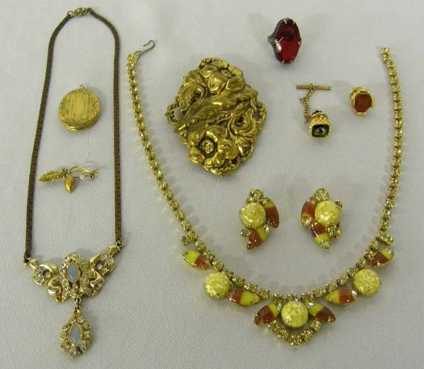Vintage Estate Jewelry including Repousse' Manta Pin: Collection of Fine Estate Costume Jewelry. Includes 1 necklace, 1 necklace and earring set, 1 locket, 1 red stone ring size 5, 1 Repousse' Manta clip (2.75''x2''). SHI $15.