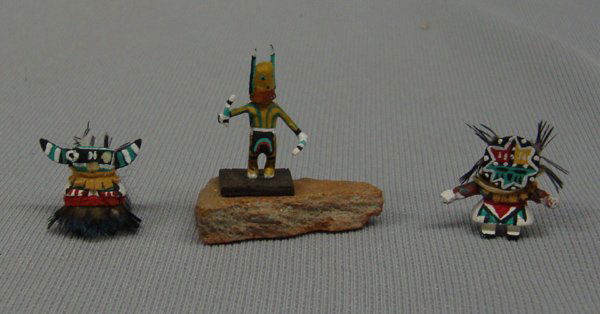 3 Miniature Navajo Kachinas: 3 Miniature Kachinas. The figure on a stone has a removable mask head as shown in the photo and only measures 1"H. One figure (with the horns) is missing one eye and his nose & measures less than .5".