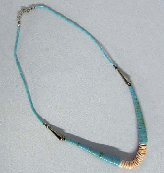 Santo Domingo Turquoise Shell Heishi Necklace: Santo Domingo Necklace, Turquoise & Shell Heishi. Measures 20'' end to end. Large Sterling Silver Cone Beads, & Red Shell Corn Beads. SHI $15.