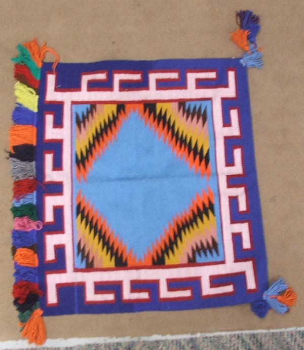 Navajo Sunday Saddle Blanket with Multi Colored Tassles: Navajo Sunday Saddle Blanket Measures 32'' (W/fringe)x32'' and has 10'' tassels. SHI $15.