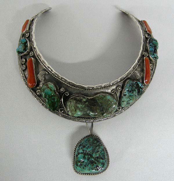 Navajo Silver Turquoise Coral Nugget Necklace : Navajo Sterling Gorget Neck Bracelet Hallmarked. Set with Turquoise and Coral nuggets. Nugget drop. Neck measures approx. 15'', pendant measures approx. 2'' x 1.25''. SHI $20.