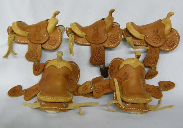 5 Miniature Hand Tooled Western Saddles: 5 Miniature Hand Tooled Western Saddles. Measure 2''x3.5''. SHI $15.