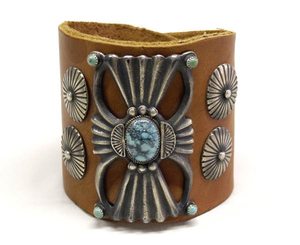Navajo Lone Mountain Turquoise Ketoh Bracelet: Navajo Lone Mountain Turquoise Ketoh Leather Bracelet. Bracelet measures approx. 8 1/2" x 3 1/2" the turquoise stone measures approx. 3/4"L x 1/2". SHI $20.