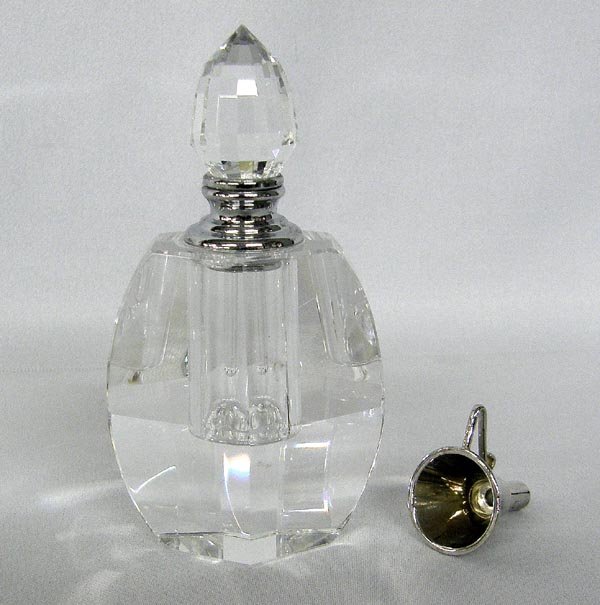 Crystal Perfume Bottle With Funnel: Crystal Perfume Bottle With Funnel, dobber is in tacked. Measures approx. 3.5'' x 2.25''. SHI $20.