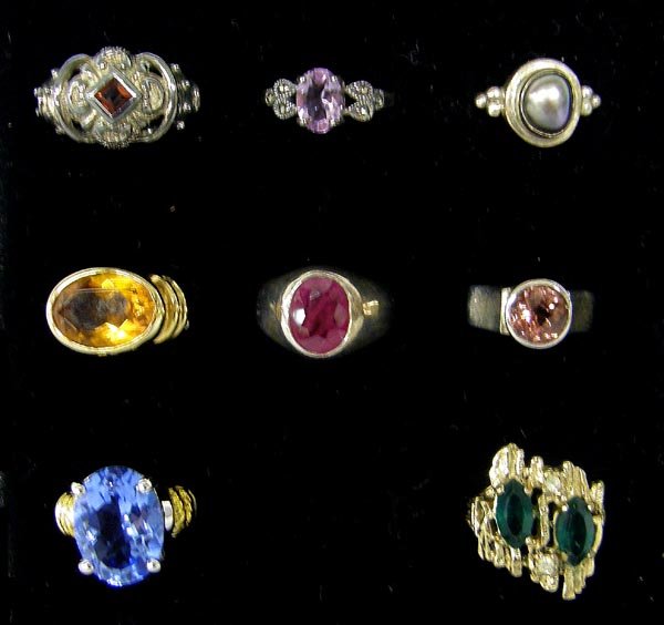 8 Rings some Semi Precious Stone various Sizes: 8 Rings. Starting at top of picture, the garnet ring size 7.75 is marked 18Kt HGE, the middle amethyst ring size 7.25 no marking, pearl ring size 6.5 Sterling CETA, Citrine size 6.5 925 KH, Red ring s