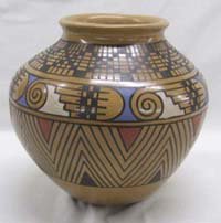 Mata Ortiz Pottery by Jesus Pena: Mata Ortiz Pottery by Jesus Pena, measures approx. 6.5 x8". Has a lizard around the pottery piece. SHI $25