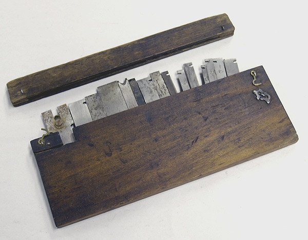15 Antique Plane Cutter Blades In Box: 15 Antique Plane Cutter Blades In Box, box measures approx. 1/2" x 10" x 4 3/4".