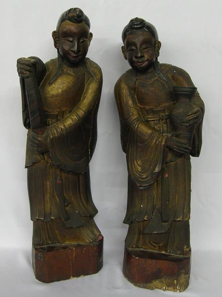 2 Antique Mongol Quan Yin Water Bearer Wooden Statues: 2 Antique Mongol Quan Yin Water Bearers Statues. These are elmwood statues with bronze finish from Wutai Shan. One has damage on back and base as shown in photograph. Each measures approx. 28''x8''x7'