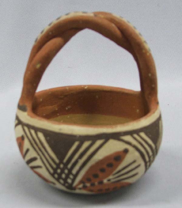 1950s Vintage Isleta Pottery Basket: Vintage Isleta Pottery Basket, measures approx. 3 1/2''. Reads Isleta Tribe on the bottom of the pottery basket. SHI $20.