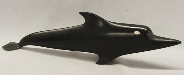 NW Coast Carved Ebony Wood Dolphin: North West Coast Carved Ebony Wood Dolphin, mother of pearl eyes. Damage to tail fin. Measures approx. 3'' x 11.5''. SHI $20.