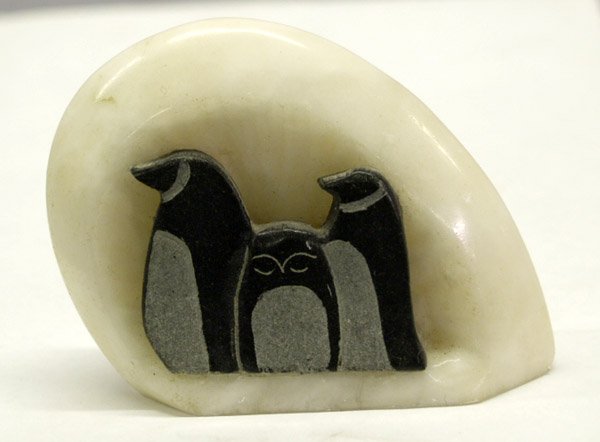 Alaskan Stone Penguin Carving: Alaskan Stone Penguin Carving. Penguins carved from black stone and set into carved white stone. Measures 2''x3''x1''. SHI $15.