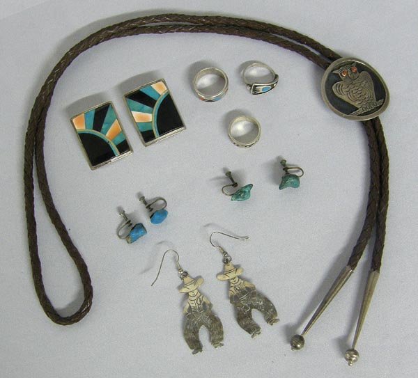 8 Navajo Rings, Bolo, Earrings, Asst. Jewelry: 8 Navajo Rings, Bolo, Earrings, Asst. Jewelry. Pair Sterling Cowboy earrings hallmarked ''BB.'' Pair sterling inlay earrings (1.25''x1.5''). Two pairs screw back turquoise nugget earrings. 3 rings - t