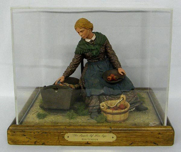 1986 Original Sculpture in Plexiglas Case by Tunison: Original Sculpture in Plexiglas Case by Ron Tunison, Titled, ''The Apple of Her Eye.'' Base of frame is 11.5''x9''. Sculpture is approx. 7.5''x9''x7''. SHI $35.