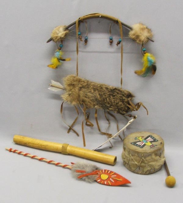 4 Native American Miniature Toy Collection: 4 Native American Toy Collection. Largest item measures approx. 14.5''. Drum, flute, bow with quiver, toy arrow. SHI $20.