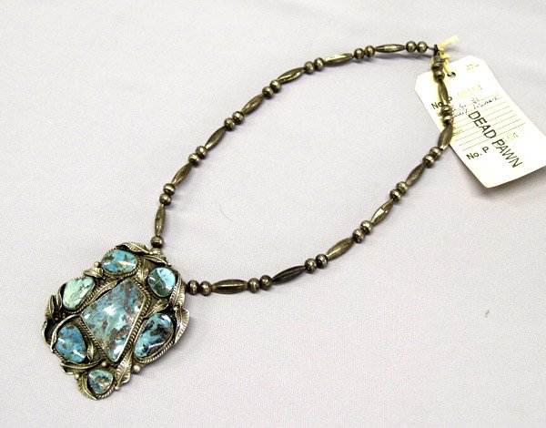 Old Pawn Navajo Silver Turquoise Pendant Necklace: Old Pawn Navajo Silver Turquoise Necklace W/Ticket. Silver bead necklace is 20.5'' end to end. Pendant is 3.25'' long with Hallmark on back. Center nugget is 1-3/8''x1-3/8''. SHI $15.