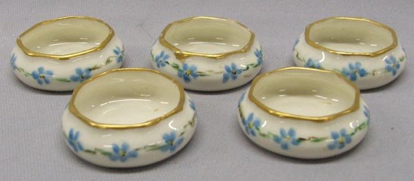 5 Belleek Willets Salt Cellars: 5 Belleek Willets Salt Cellars, forget me not design with gold trim. Measures approx. 1/2''H x 1 1/2''W. SHI $20.