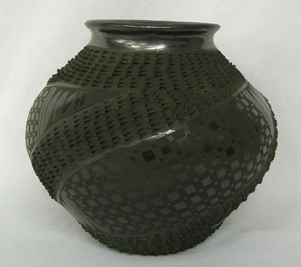 Mata Ortiz Textured Black Pottery by Mario Olivas: Mata Ortiz Textured Black Pottery by Mario Olivas. Measures 7''x8''. SHI $25.