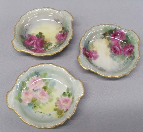 3 Antique Bavarian Porcelain Coasters: 3 Antique Bavarian Porcelain Coasters or Butter Pat Bowls. Each measures 7/8''Hx4.25''W. SHI $25.