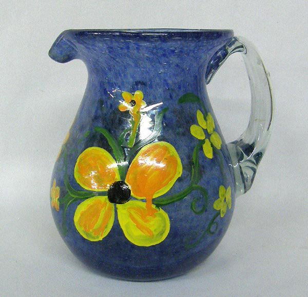 MX Hand Painted Glass Pitcher By Kills Thunder: Mexican Hand Blown Glass Pitcher, Hand Painted By Kills Thunder. Measures approx. 6 1/2'' tall. SHI $25.