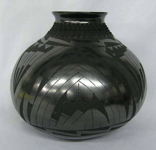Mata Ortiz Black on Black Pottery by Amelia Mora: Mata Ortiz Black on Black Pottery by Amelia Mora. Highly burnished, textured neck. Measures 9.5''x10.5''. SHI $25.